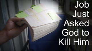 A picture of my bible being held open with sticky notes an such. The bible is illuminated and in the darkness, it says "Job just asked god to kill him."